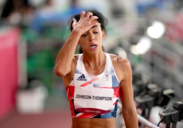 Katarina Johnson-Thompson with her eyes closed and her right hand on her head. 