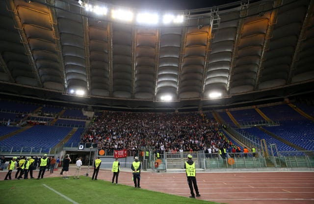 Liverpool fans are held in the stadium after the match (Steven Paston/PA)