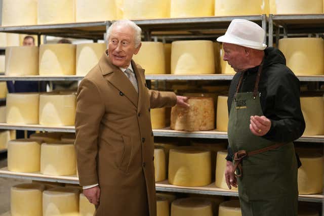 The King during a visit to a cheese factory