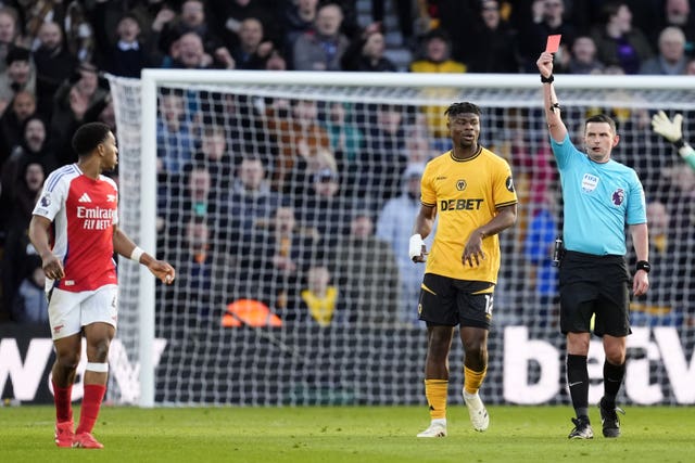 Arsenal’s Myles Lewis-Skelly is shown a red card by referee Michael Oliver