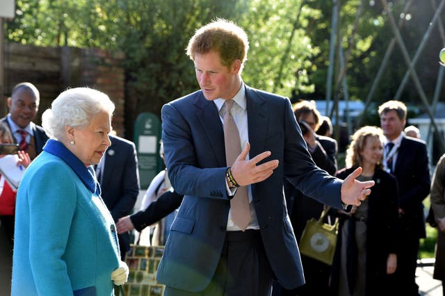 Harry shows his grandmother the Queen around the Sentebale garden (Julian Simmonds/The Daily Telegraph/PA)