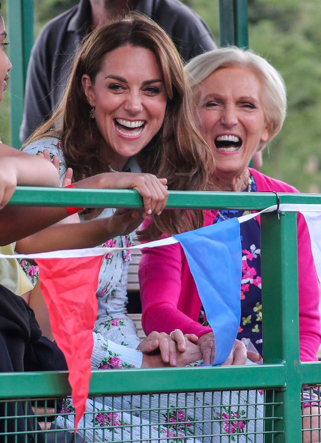 The Duchess Of Cambridge rides on a tractor and trailer with Mary Berry, during a visit to the ‘Back To Nature’ Festival at RHS Garden Wisley (Steve Parsons/PA)