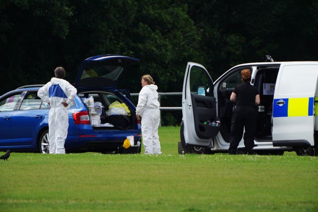 Police forensic officers at the scene in the Sarn area of Bridgend