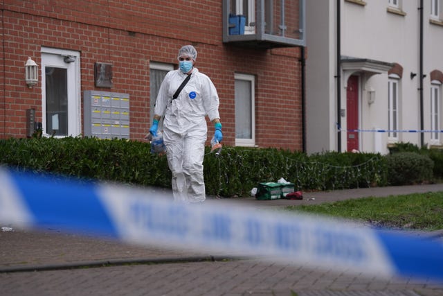 A police cordon and a forensic officer at the scene in Newton Leys 