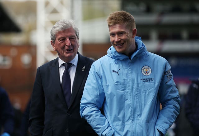 Crystal Palace manager Roy Hodgson shares a joke with Kevin De Bruyne 