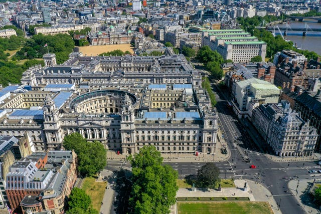 An aerial view of London at the junction of Parliament Street, Great George Street and Parliament Square, with St James’s Park on the left with government buildings which house departments including: The Treasury, the Department for Digital, Culture, Media and Sport, HMRC, the Foreign and Commonwealth Office, Downing Street, the Cabinet Office and Horseguards Parade, and (right) the Ministry of Defence, the Old War Office Building and the Department for International Trade