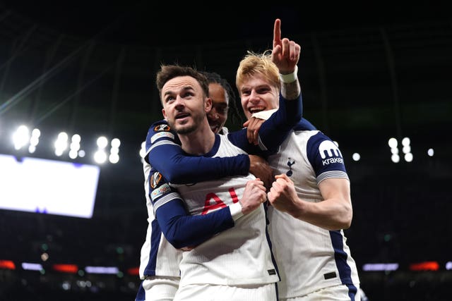 James Maddison (left) celebrates with team-mates Lucas Bergvall (right) and Djed Spence after scoring for Spurs