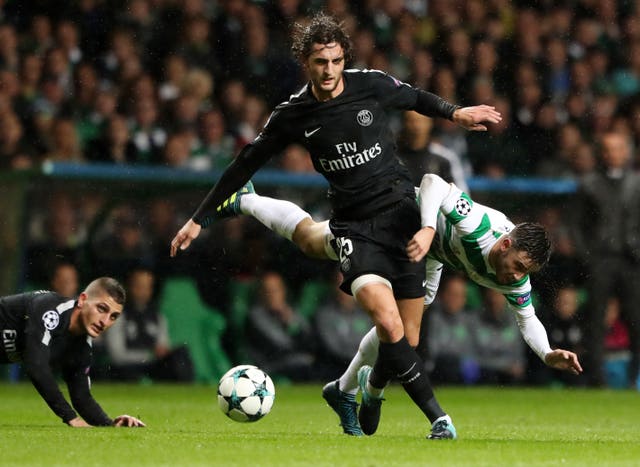 A Celtic player challenges Paris St-Germain’s Adrien Rabiot during the UEFA Champions League, Group B match at Celtic Park, Glasgow