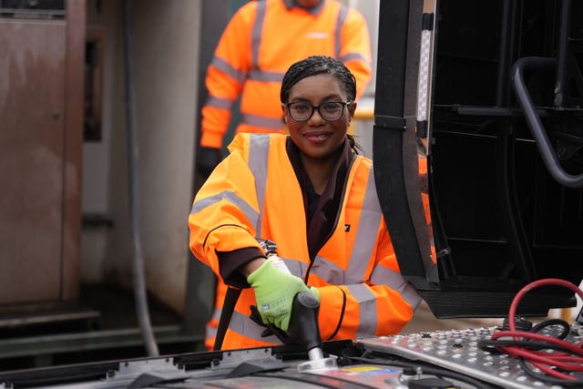 Kemi Badenoch wearing an orange hi-vis jacket