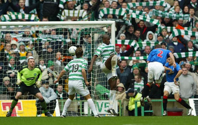 Fernando Ricksen heads home in an Old Firm derby 