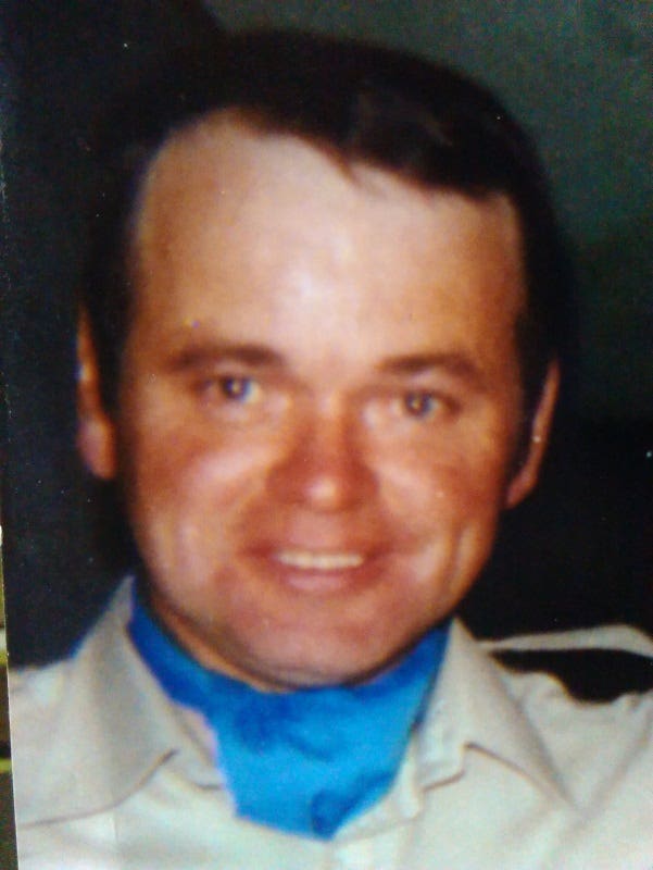 Head shot of a man with dark hair