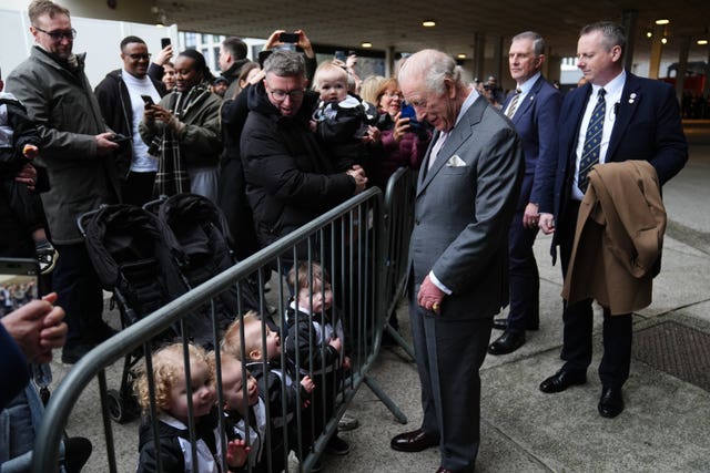 King meets local children as he leaves following his visit to Aviva Studios, in Manchester