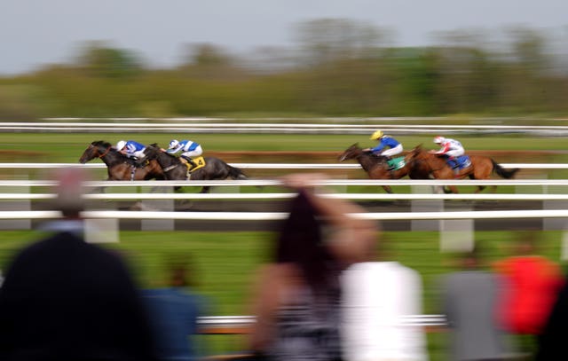 Notre Belle Bete (second left) in winning action at Kempton