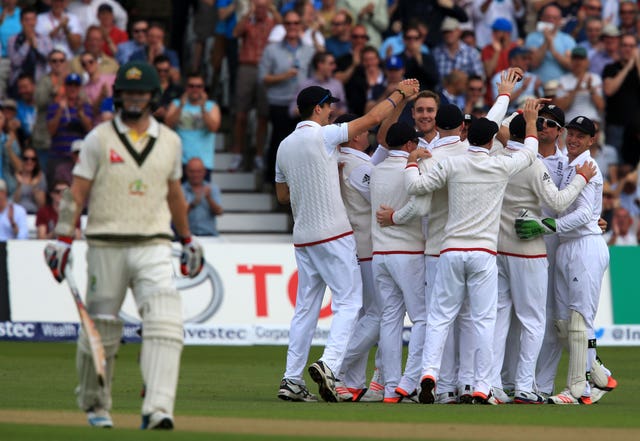 England bowler Stuart Broad is mobbed after he claimed his 300th Test wicket after Australia opener Chris Rodgers were dismissed for a duck in the 2015 Ashes series 