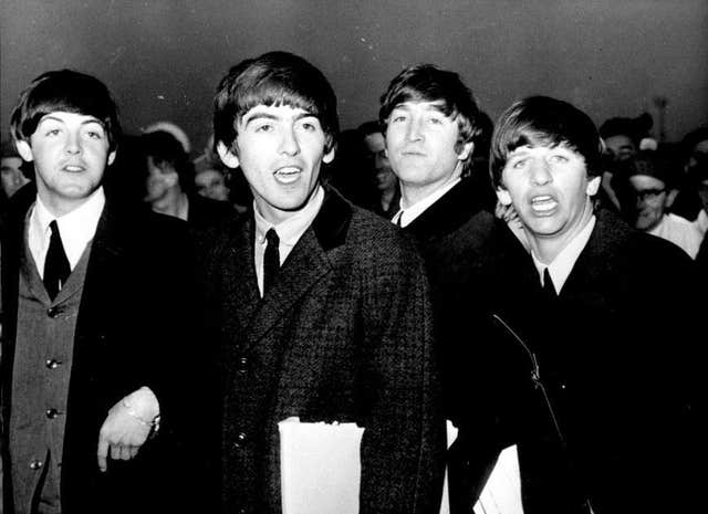 Black and white photo of Sir Paul McCartney, George Harrison, John Lennon and Ringo Star