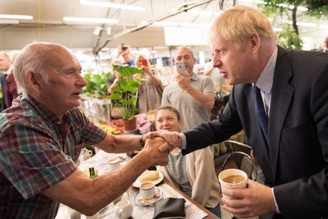 Conservative Party leadership contender Boris Johnson meets customers during a visit to Polhill Garden Centre near Halstead in Kent