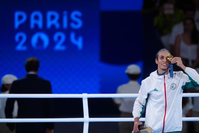 Gold nedallst Imane Khelif on the podium for the women's 66kg at Roland Garros Stadium on day 14 of the 2024 Paris Olympics