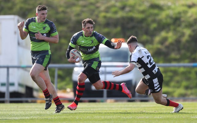 Gavin Henson, centre, experienced a low-key debut in rugby league as his West Wales Raiders team suffered a 58-4 defeat by Widnes in the first round of the Betfred Challenge Cup (David Davies/PA)