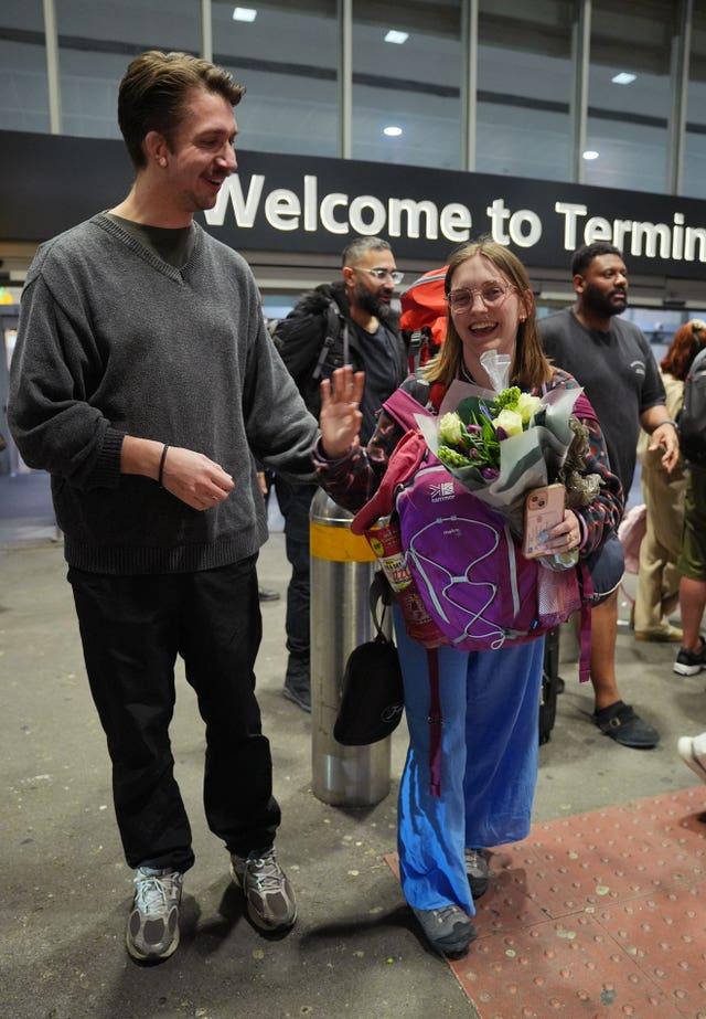 Cath from the UK is embraced by her fiance Dom