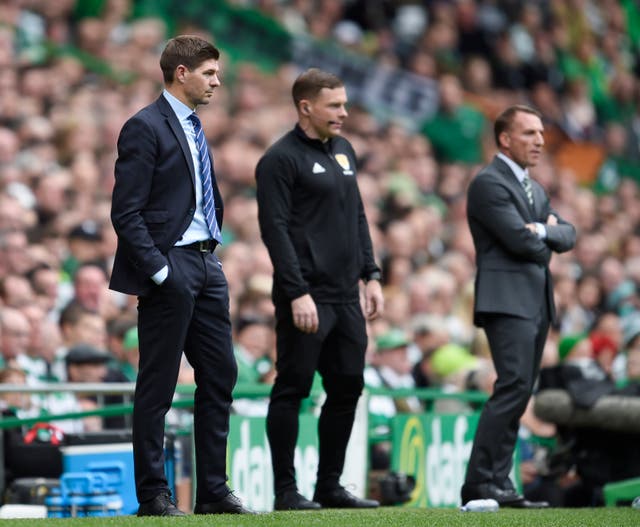 Gerrard (left) watched Rangers lose 1-0 to Brendan Rodgers' Celtic in his first Old Firm clash back in 2018