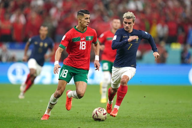 Morocco’s Jawad El Yamiq (left) and France’s Antoine Griezmann battle for the ball during the FIFA World Cup Semi-Final match at the Al Bayt Stadium in Al Khor, Qatar