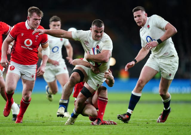 England’s Ben Earl is tackled during a game against Wales