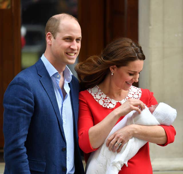 William is all smiles as Kate gazes lovingly at her son (Dominic Lipinski/PA)