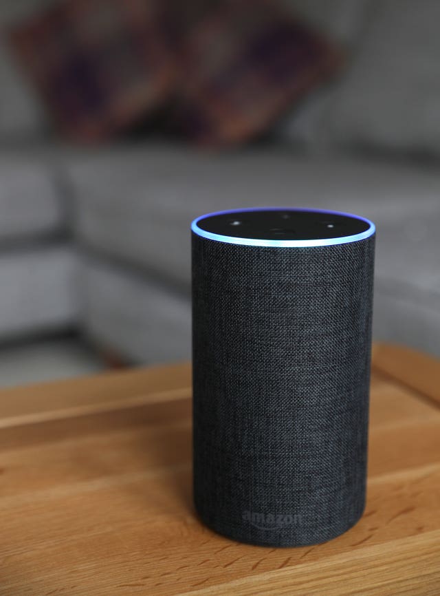 A general view of a black Amazon smart speaker on a wooden table