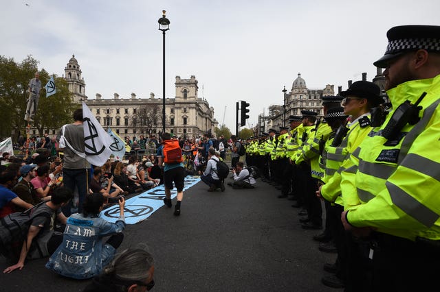 Police watch Extinction Rebellion protesters 