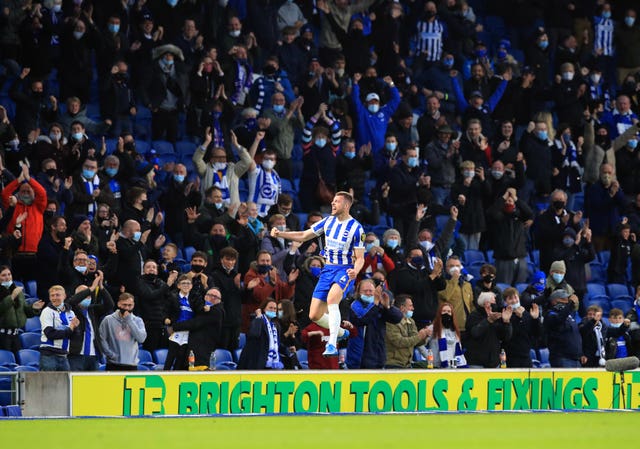 Brighton's Adam Webster celebrates scoring in front of home fans at the AMEX Stadium