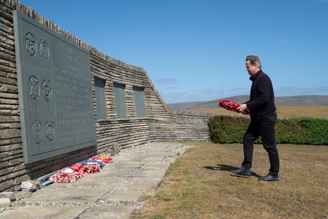 Lord Cameron taking part in a wreath laying ceremony the Falkland Islands