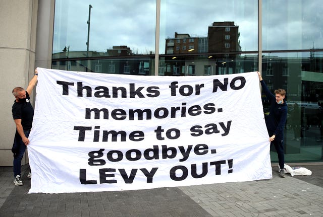 Fans stage a protest outside of the Tottenham Hotspur Stadium