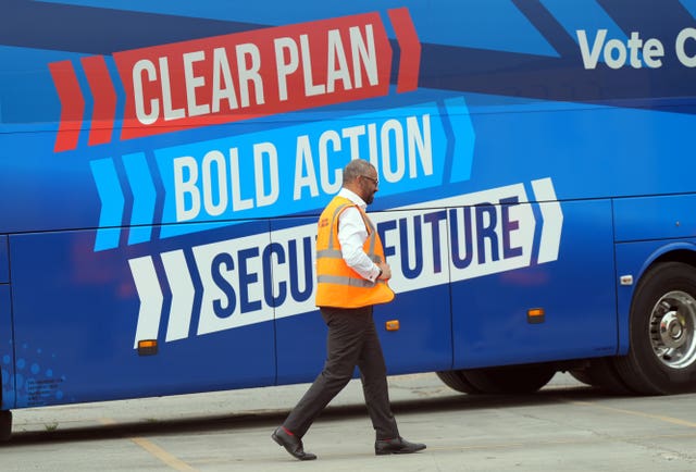 Home Secretary James Cleverly dons a hi-vis vest as he arrives for a visit to Swain Group in Rochester, Kent, while on the General Election campaign trail 