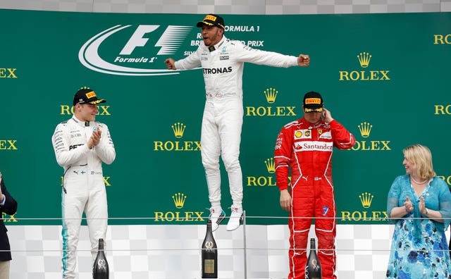 Lewis Hamilton celebrates on the podium during the 2017 British Grand Prix