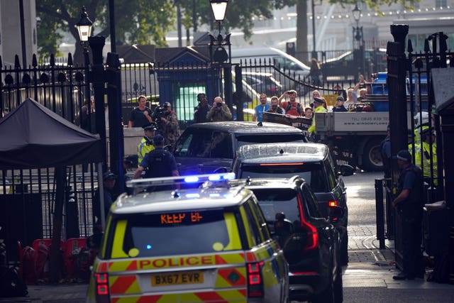 A cavalcade of cars carrying outgoing Prime Minister Boris Johnson 