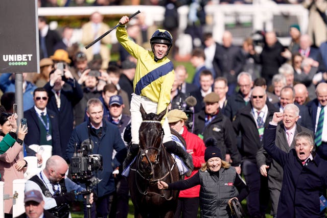 The late Michael O'Sullivan celebrates winning the Supreme Novices' Hurdle on Marine Nationale