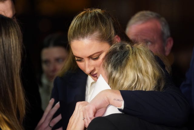 Nikita Hand hugs another person outside the High Court in Dublin 