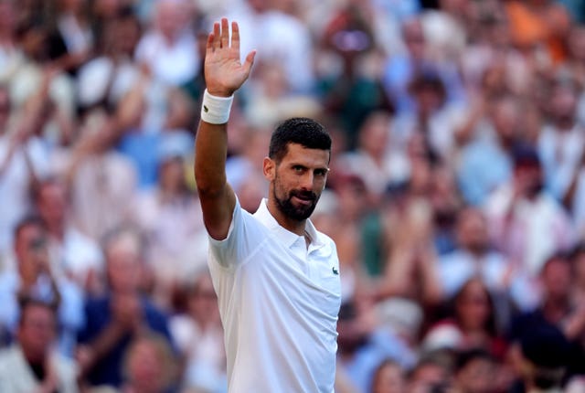 Novak Djokovic waves to the Centre Court crowd (