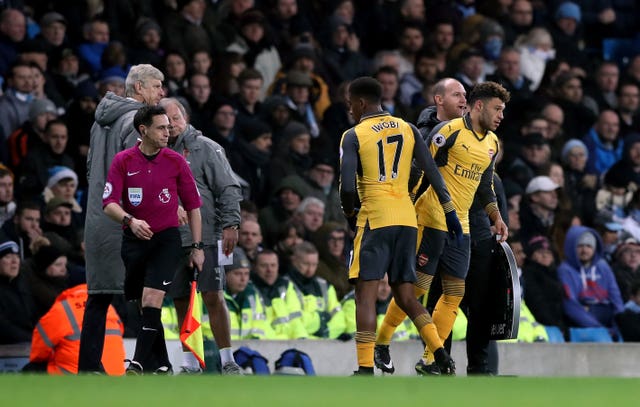 Wenger (left) has handed Iwobi a run of games of late. 