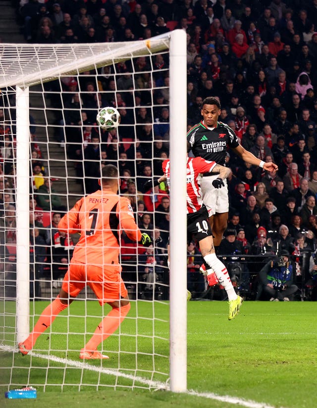 Jurrien Timber, right, heads home Arsenal’s first goal against PSV Eindhoven