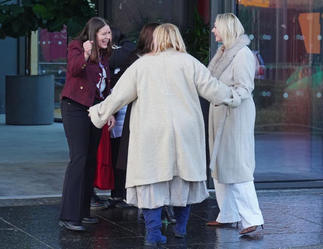 A group of nurses hug as they leave a press conference at the Crowne Plaza Hotel, Newcastle 