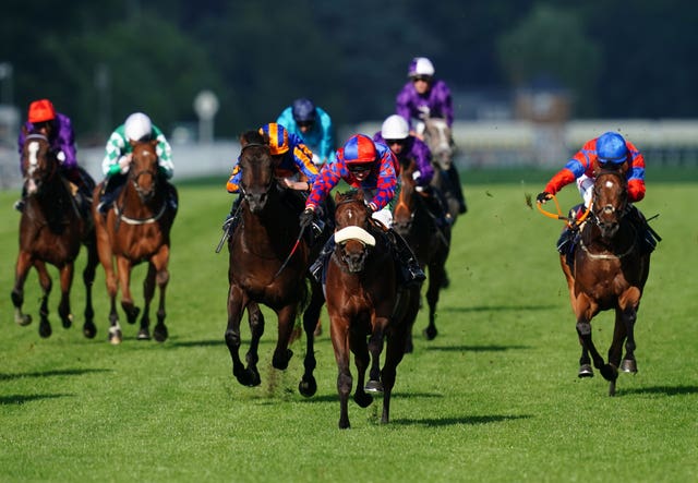 Big Evs and Jason Hart (centre) coming home to win the Windsor Castle Stakes at Royal Ascot 
