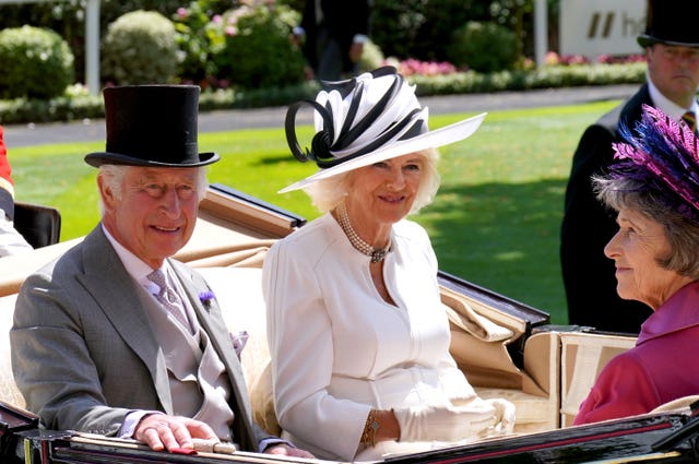 King Charles III, Queen Camilla and the Duchess of Devonshire arrive by carriage during day four of Royal Ascot