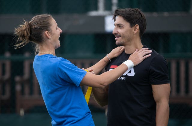 Karolina Pliskova looked relaxed at her practice session with husband Michal Hrdlicka