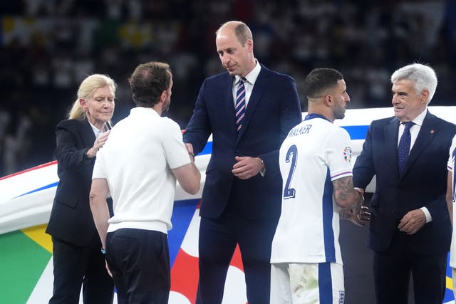 The Prince of Wales shakes hands with Gareth Southgate on the pitch after England's Euro defeat 