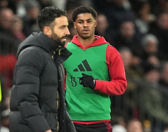 Manchester United’s Marcus Rashford warms up on the sidelines during a Premier League match at Old Trafford