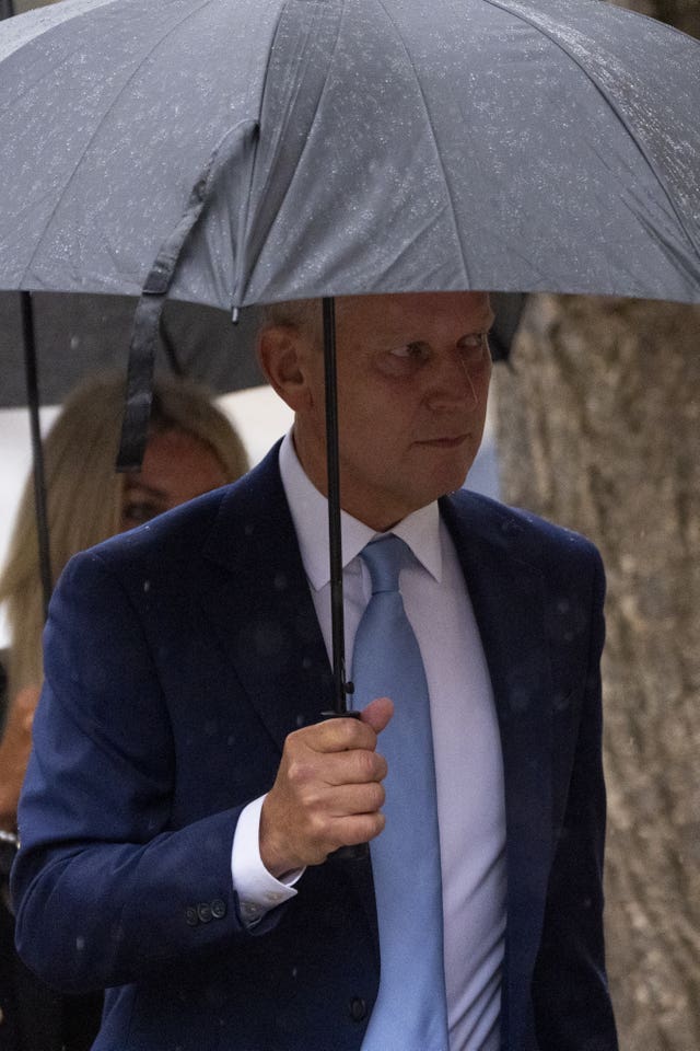 Jeremy Kyle holding an umbrella arriving at Winchester Coroner’s Court