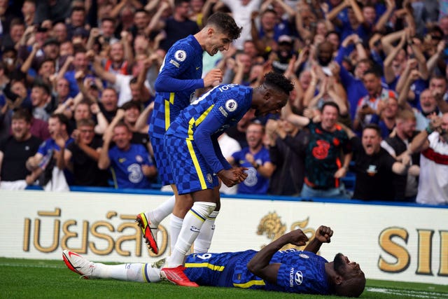 Chelsea players celebrate Romelu Lukaku''s (bottom) opening goal