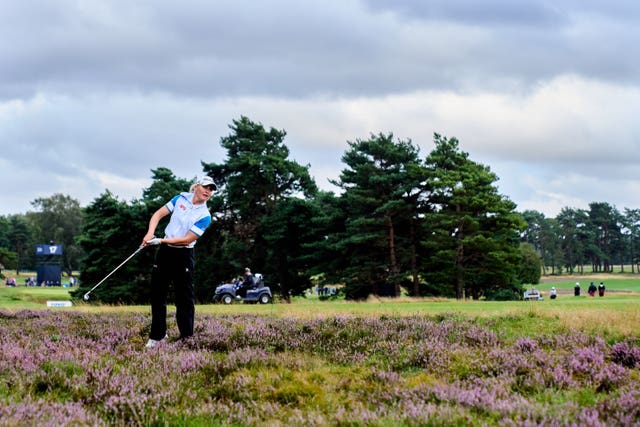 Charley Hull plays out of the rough on 18 and went on to par the final hole to tie for the lead at Walton Heath