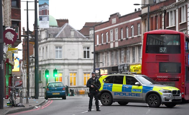 Police at the scene of Sunday's attack in Streatham High Road 